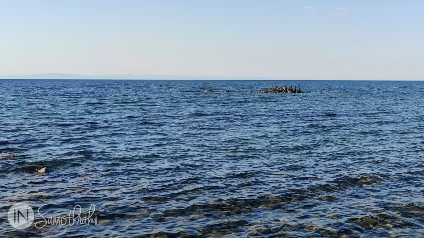 Cormorants on the rocks in the sea