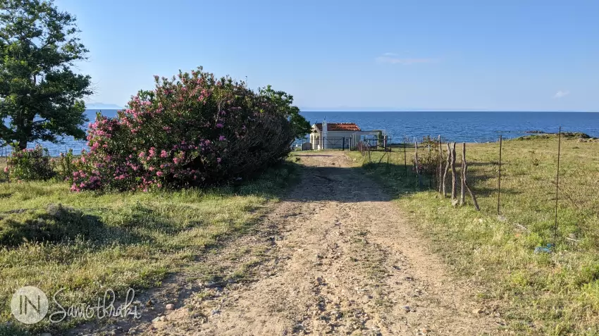 From the main street, a dirt road takes you to the church on the shore.
