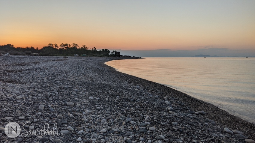 Fonias Beach at sunset and the tower in the distance