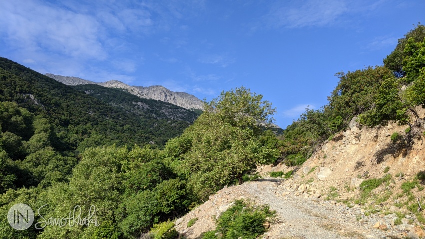 Boulders and rocky terrain become increasingly common along the path.