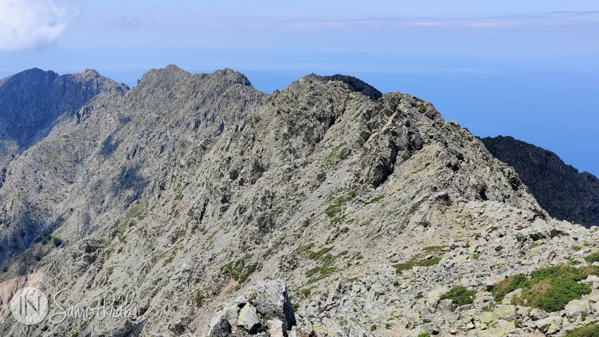 Three main peaks are situated along the ridgeline.