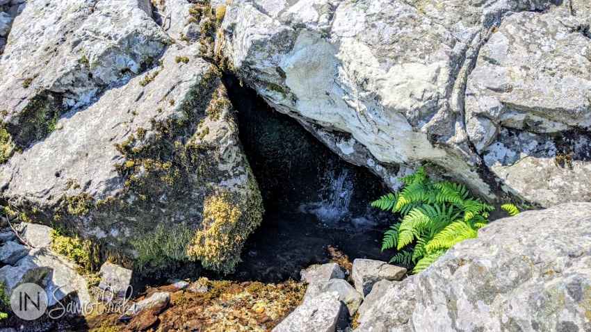 Kalamithria Spring is hidden among the rocks. Be aware that there might not be enough water for you to refill your bottle.