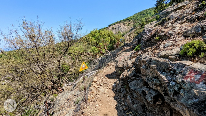 Then it becomes less abrupt and turns towards the river.