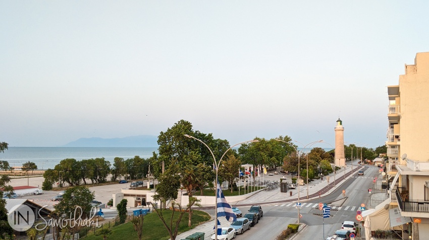 Alexandroupoli. The emblematic lighthouse is to the right, the entrance to the port is to the left and the island of Samothraki in the distance.