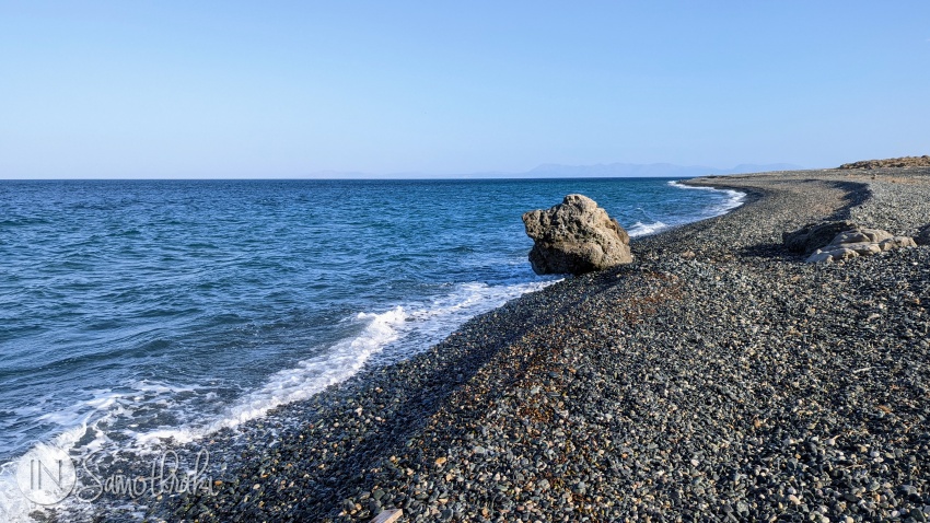 Kipos is an endless stretch of dark colored pebbles, bathed by the dark blue waters of the sea