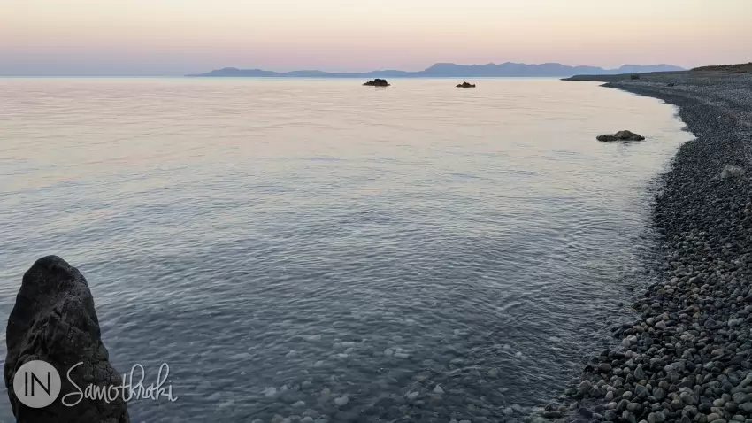 The fading sun paints the sea and the island of Gokceada in beautiful pinkish hues