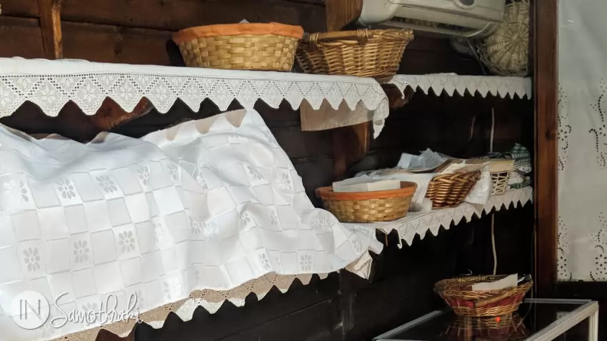 The goodies hide in baskets, on shelves covered with traditional towels.
