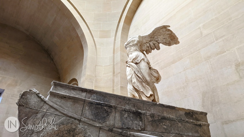 The goddess Nike steps onto the prow of a ship.