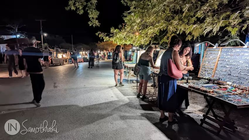 Stalls with all kinds of products, line both sides of the road.